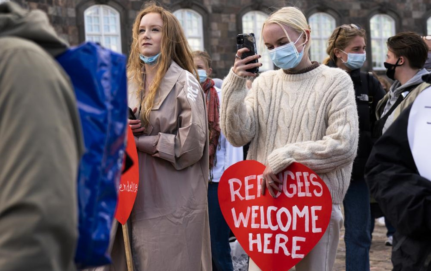 People attend a demonstration against the tightening of Denmark's migration policy and the deportation orders in Copenhagen, Denmark on April 21, 2021. Photo: David Keyton/AP